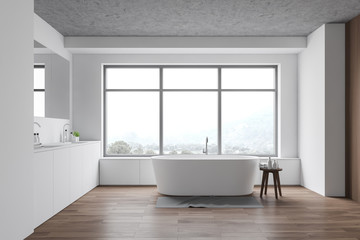 Spacious white bathroom with sink and tub