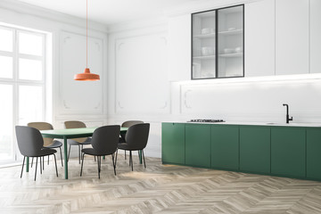 White and green kitchen corner with long table