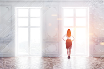 Woman in suit in empty room with windows