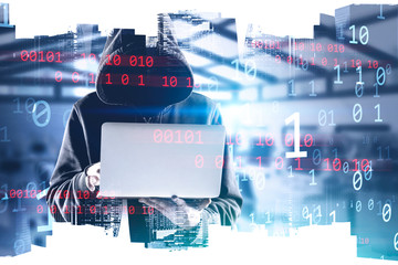 Hooded hacker with laptop in city, binary numbers