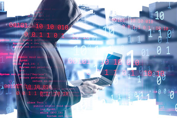Side view of hacker in city, binary numbers