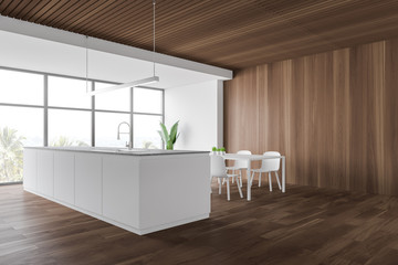 White and wooden kitchen corner, table and counter