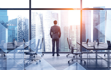 Business leader looking at city, brainstorm