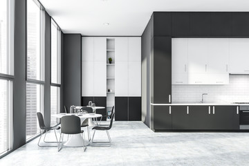 Gray and white kitchen with countertops and table