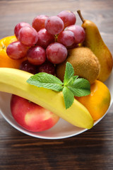 Whole fruits on a white plate. Restaurant menu