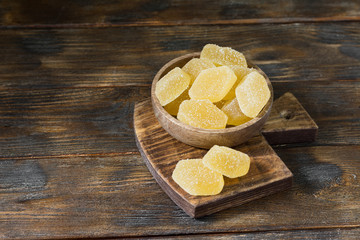 Marmalade sprinkled with sugar in a bowl on a wooden Board	