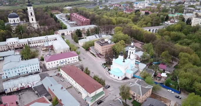 Aerial panoramic view of modern cityscape of Kaluga on banks of Oka river overlooking black domes of Holy Trinity Cathedral 