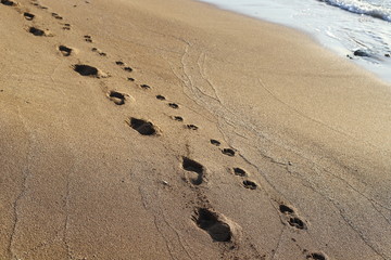 footprints in the sand on the shores of the Mediterranean Sea in the north of Israel