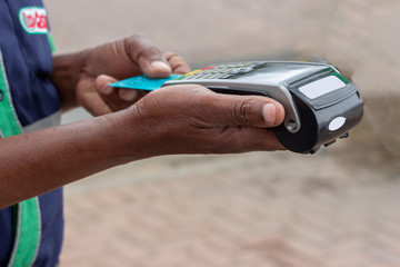 african american using a credit card machine