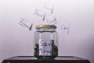 Conceptual images for saving and using budgets or money. Money saving ideas and copy space