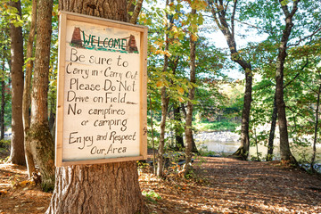 Handmade welcome sign at the beach access south of the Wire Bridge in New Portland, Maine. Photographed on October 5, 2019.