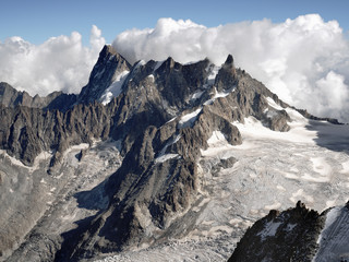 Obraz premium Grandes Jorasses 4,208 m (13,806 ft) and Dent du Geant mountain, Haute-Savoie, France. Late summer landscape of high alpine Mont Blanc massif with glaciers.