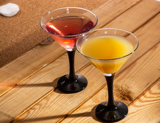 Glasses of fruit drinks are on the table.