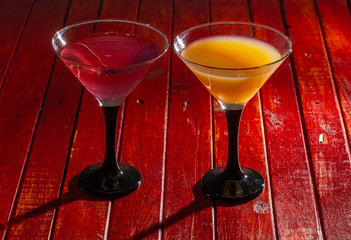 Glasses of fruit drinks are on the table.