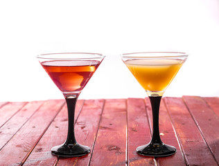 Glasses of fruit drinks are on the table.