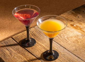 Glasses of fruit drinks are on the table.