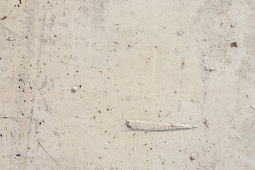 Light concrete surface with flaws