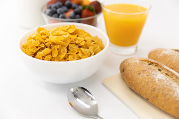 Healthy breakfast. bread, orange juice, strawberry, blueberries, milk and cereal in bowl on white background. Healthy food
