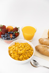 Healthy breakfast. bread, orange juice, strawberry, blueberries, milk and cereal in bowl on white background. Healthy food