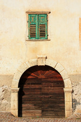 Fototapeta na wymiar Vintage window with shutters and door