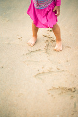 Fototapeta na wymiar Happy Asian Family with Little Kid Having Fun at the Beach. Joyful Family. Travel and Vacation