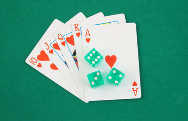 Dices and cards on green table, gambling concept
