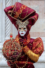 Beautiful Venice carnival mask and venetian costume at the annual festival in Venice Italy