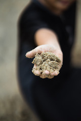 A hand full of sand