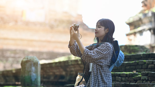 Young woman take a picture with travel holiday concept.