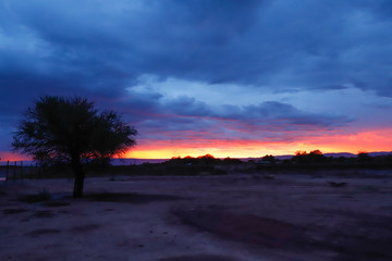 Fototapeta na wymiar Sunset lights in the arid landscape of the Atacama desert in northern Chile