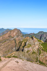 Mountain landscape with the highest mountain of Madeira island Pico Ruivo photographed from the Pico do Arieiro, the third highest peak of the Portuguese island. Hiking, trekking, mountain climbing