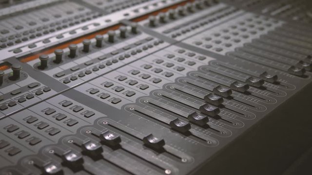 Professional recording studio. Sound recording studio mixing desk close up. Process of working on song or voice