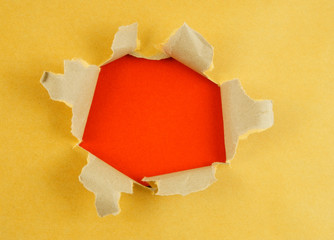 Yellow paper with hole and red background