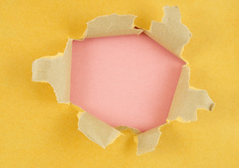 Yellow paper with hole and pink background