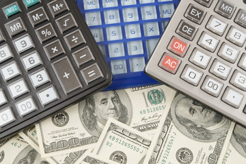Business concept, calculators on money background 
