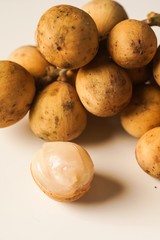 Lansium parasiticum, commonly known in English as langsat or lanzones, is a species of tree in the Mahogany family with commercially cultivated edible fruits. The species is native to South East Asia