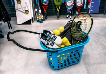 basket with tennis sports goods