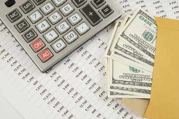 Obraz premium Business and profits concept with calculator, money in envelope and documents 