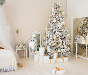 Christmas Room Interior Design, Xmas Tree Decorated By Lights Presents Gifts Toys white and gold, Candles And Garland, mirror