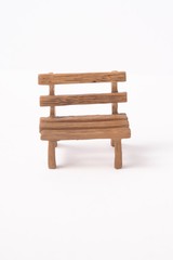 Mini wooden bench isolated against white