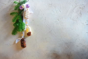 Ice cream and christmas decor on grey background.