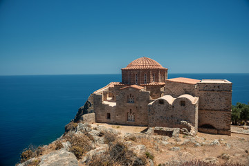 The Church of Agia Sophia on top of the plateau, with the sea in the Background in Monemvasia, Greece. 