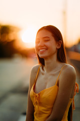 Portrait of a woman with loose long hair at sunset.