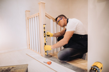Maintenance man working with a level measurement tool