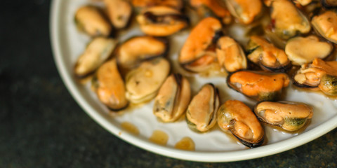 mussels in oil and spices (appetizer mollusks, pickled seafood, healthy food) menu concept. food background. copy space. Top view