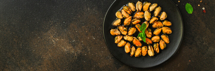 mussels in oil and spices (appetizer mollusks, pickled seafood, healthy food) menu concept. food background. copy space. Top view