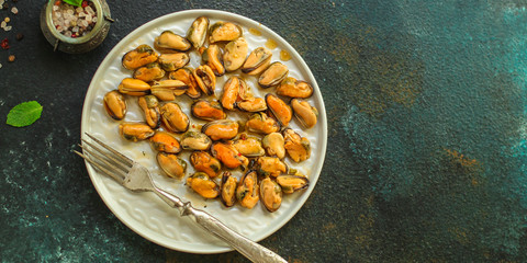 mussels in oil and spices (appetizer mollusks, pickled seafood, healthy food) menu concept. food background. copy space. Top view