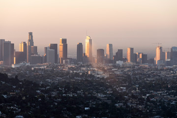 Downtown Los Angeles buildings reflecting early morning sunlight through the haze.  