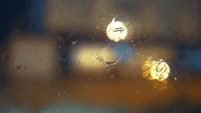 Rain dropping on a windshield, wipers on, 4K