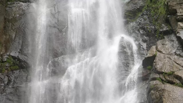 Waterfall pouring down the rocks 4K